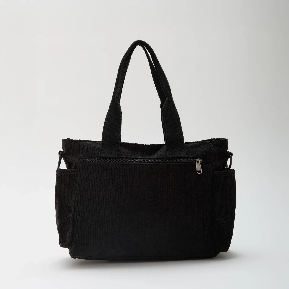 Bolso Carla de pana con correa ajustable y bolsillos con cremallera